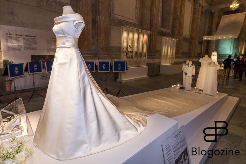 19 June 2010, Stockholm Cathedral Swedish design and tradition The Crown Princess' wedding dress is made from pearl-white double-sided duchess silk satin with a 4.6 metre long train, designed and produced by Pär Engsheden. The dress has short sleeves and a turned-out collar, which follows the rounded neckline. It has a v-shaped back with covered buttons. The sash at the waist is buttoned up at the back. The train is edged with a border, fastened at the waist, and has the same shape as the veil. The train is almost five metres long. The Crown Princess' shoes were made up in the same fabric as her dress. The Crown Princess wore Queen Sofia's lace veil, the same veil that was worn by Crown Princess Victoria's mother, Queen Silvia, at her marriage to King Carl Gustaf in 1976. Today inaugurated the new exhibition, Royal wedding dresses 1976-2015, at the Royal Palace in Stockholm. Pictures of the opening ceremony with the queen and all the princesses. - Idag invigdes den nya utställningen Kungliga brudklänningar 1976-2015 på Kungliga Slottet i Stockholm. Bilder från invigningen med drottningen och alla prinsessor. Royal Palace, Stockholm, Sweden 2016-10-17 (c) Pelle T Nilsson/Stella Pictures